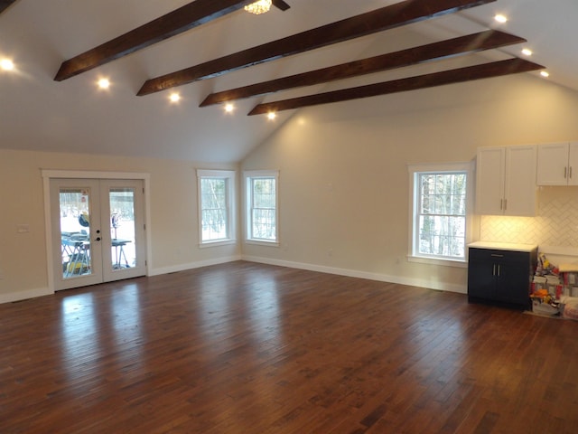 unfurnished living room featuring french doors, dark hardwood / wood-style flooring, high vaulted ceiling, and beam ceiling