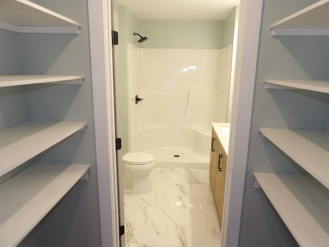 bathroom with toilet and walk in shower