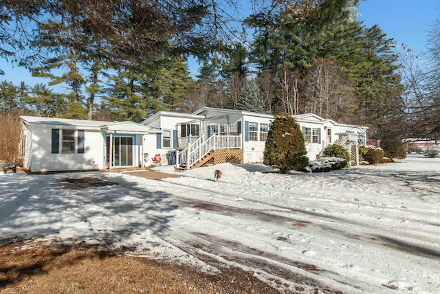 316 Depot St, Belmont, NH 03220 - manufactured / mobile home with a sunroom