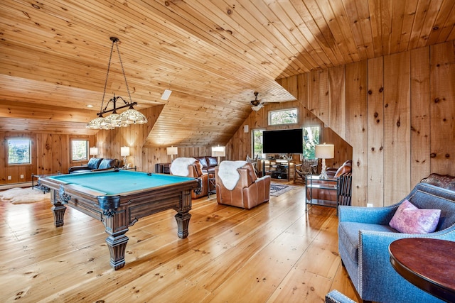 playroom featuring wood ceiling, a healthy amount of sunlight, lofted ceiling, and light hardwood / wood-style floors