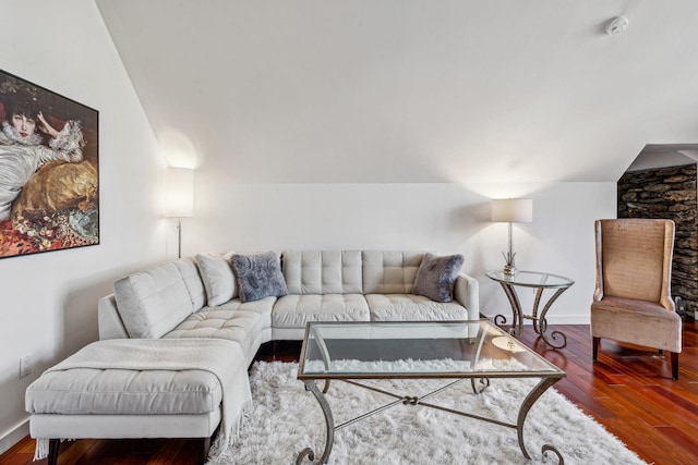 living room with hardwood / wood-style floors and lofted ceiling