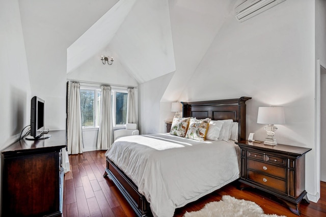 bedroom with an AC wall unit, dark wood-type flooring, and vaulted ceiling