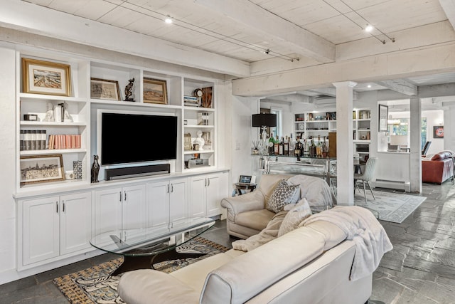 living room featuring beam ceiling, wooden ceiling, baseboard heating, track lighting, and bar