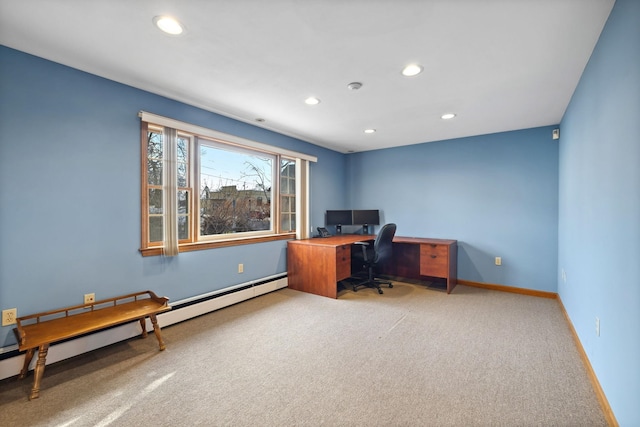 office space featuring carpet floors and a baseboard heating unit