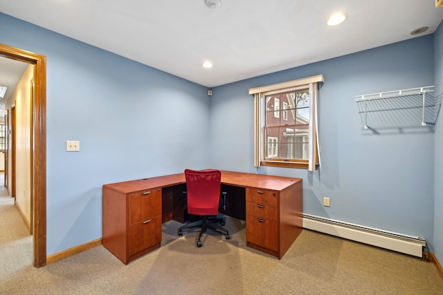 office area with light carpet and baseboard heating