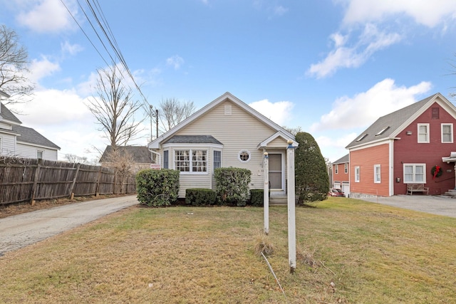 bungalow-style house with a front yard