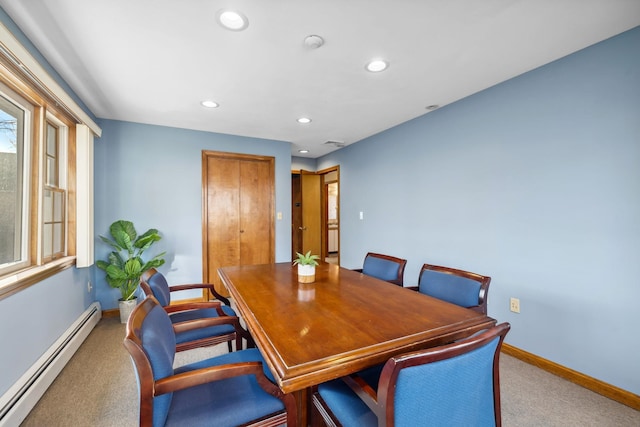 dining space with carpet and a baseboard radiator