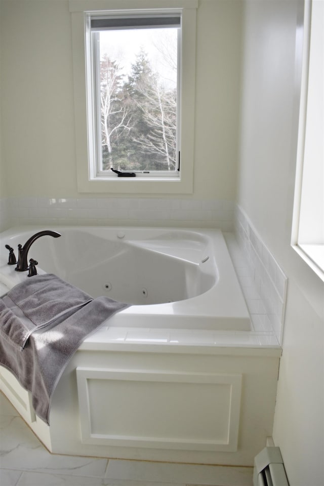 bathroom featuring a washtub