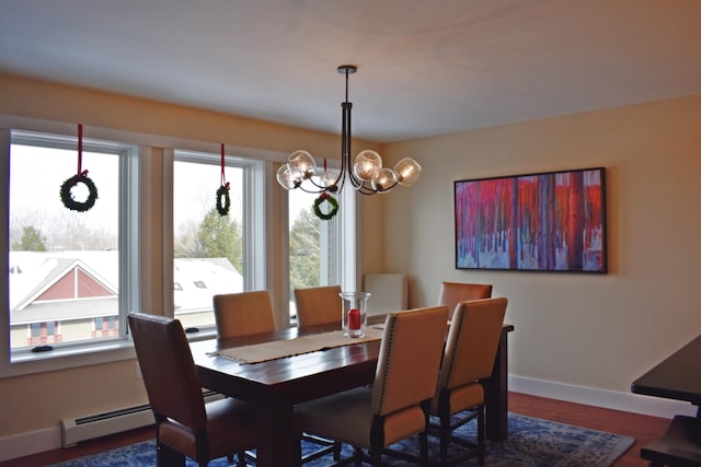 dining room with a notable chandelier, dark hardwood / wood-style floors, and baseboard heating