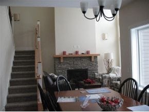 dining area with a fireplace and a chandelier