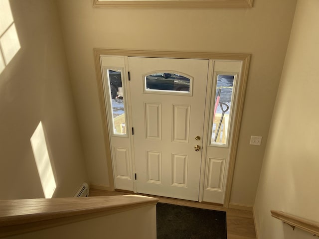 foyer featuring a baseboard radiator