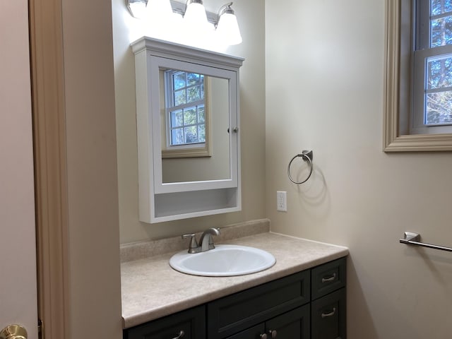 bathroom featuring vanity and a healthy amount of sunlight