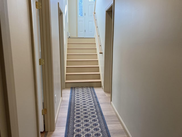 hall with light hardwood / wood-style flooring