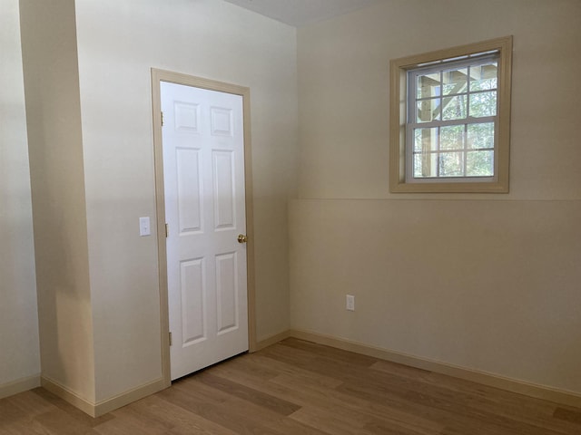 spare room featuring light hardwood / wood-style flooring