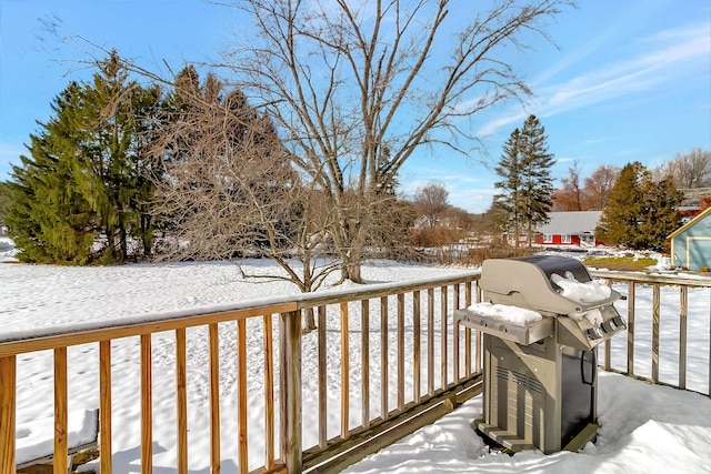 snow covered deck with area for grilling