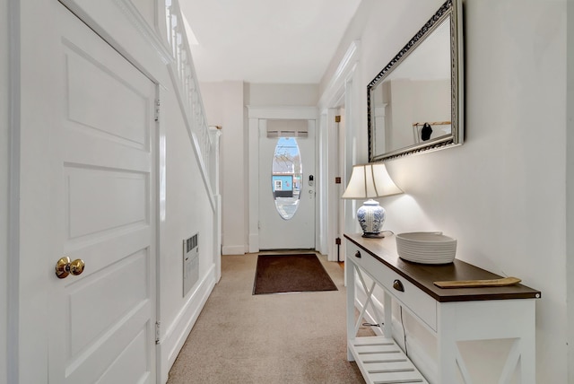 view of carpeted foyer