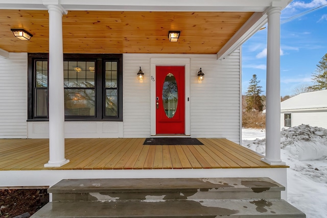 view of snow covered property entrance