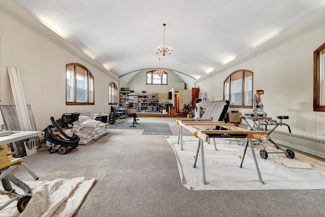 interior space featuring a healthy amount of sunlight, lofted ceiling, and a notable chandelier