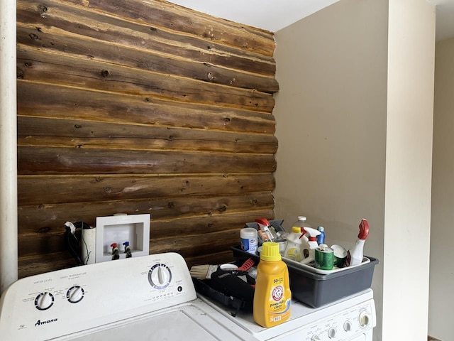 laundry area with washer / dryer and rustic walls