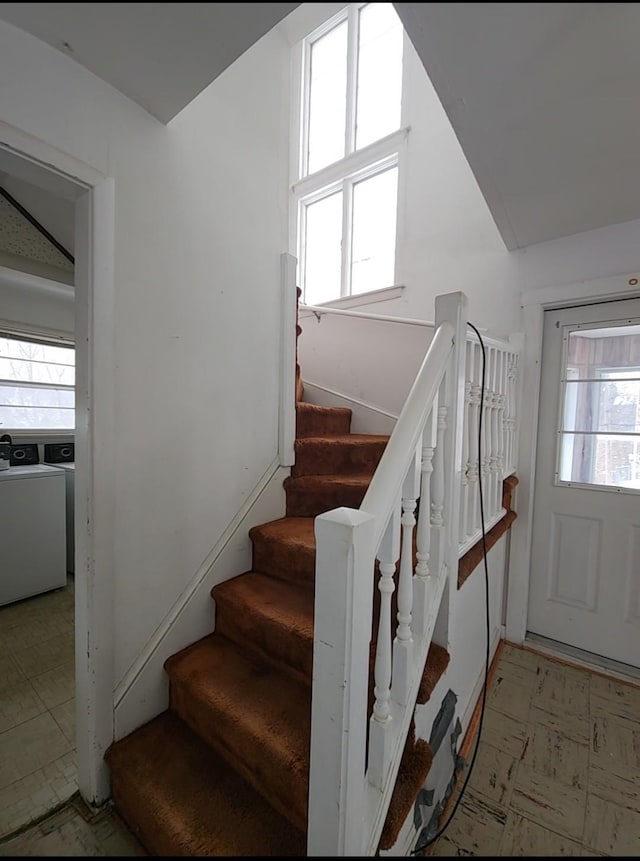 stairway featuring washer / dryer