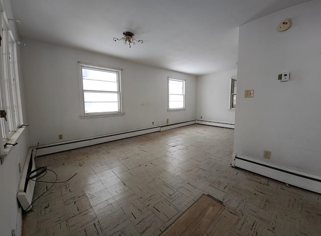 unfurnished room with a baseboard radiator