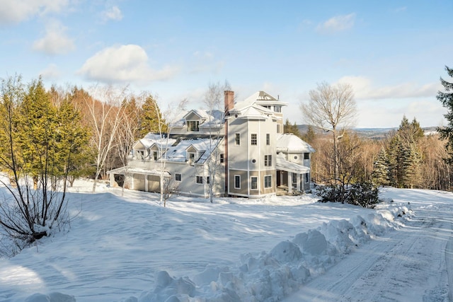 view of snow covered house