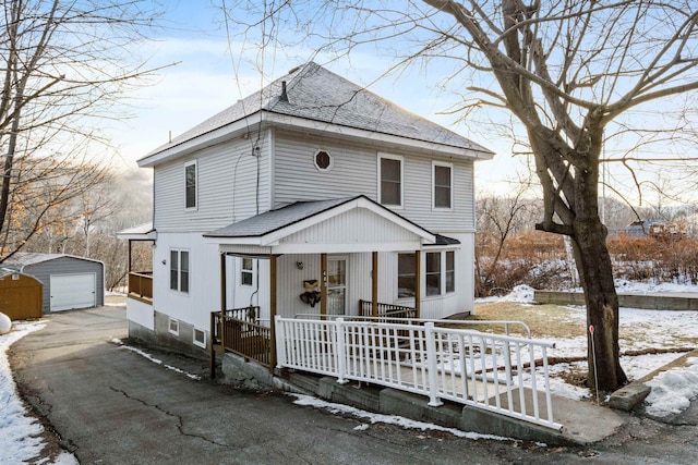 view of front facade with a garage and an outdoor structure