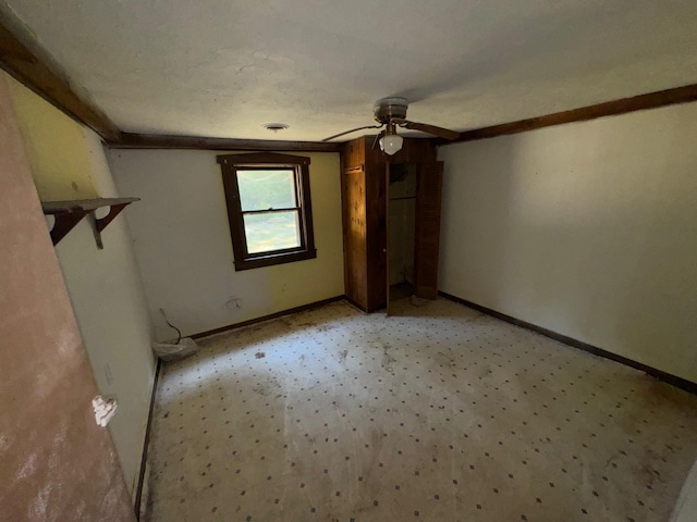 interior space featuring ceiling fan