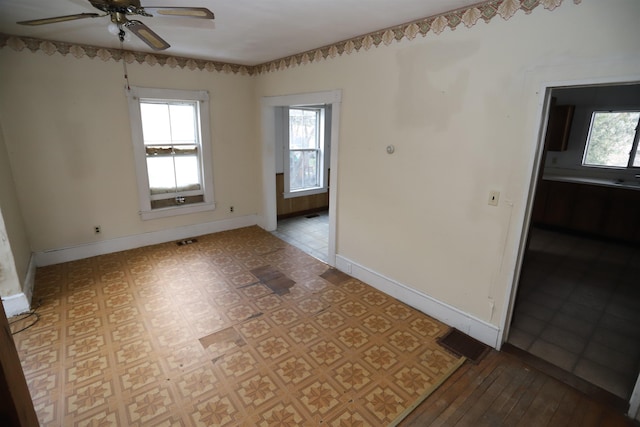 empty room featuring ceiling fan and light hardwood / wood-style floors