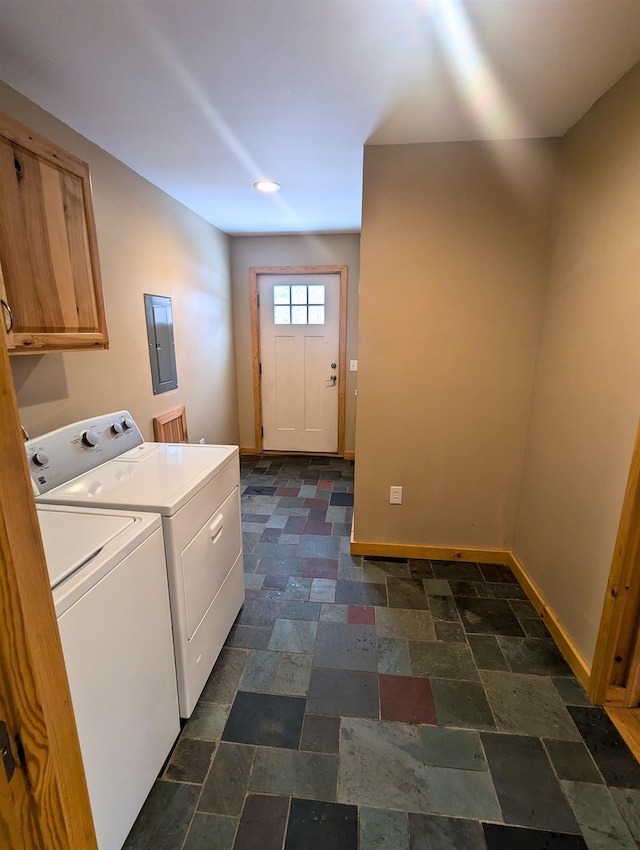 laundry area with cabinets, electric panel, and washing machine and clothes dryer