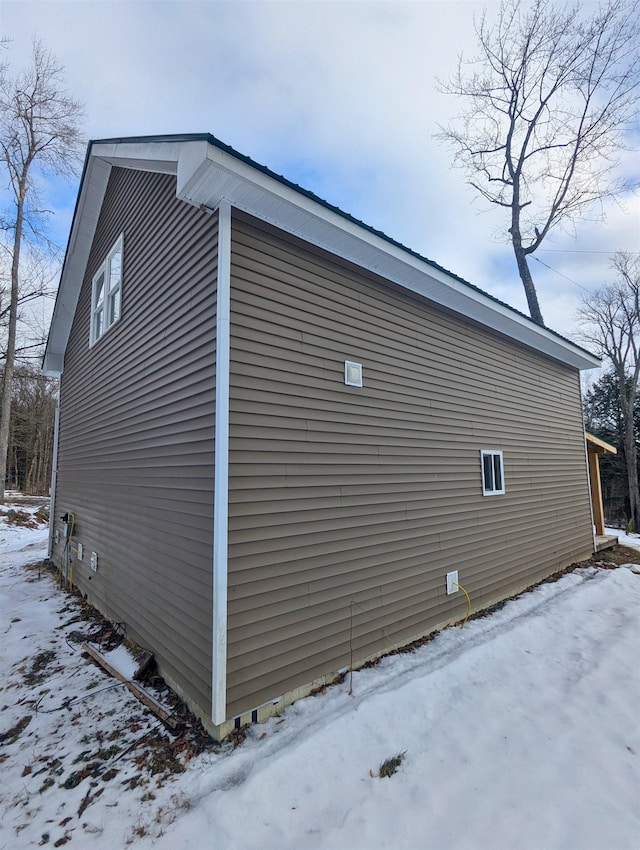 view of snow covered property