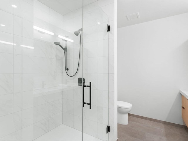 125 Cambrian Way Unit 609, Burlington, VT 05401 - full bathroom with toilet, vanity, a shower stall, and baseboards