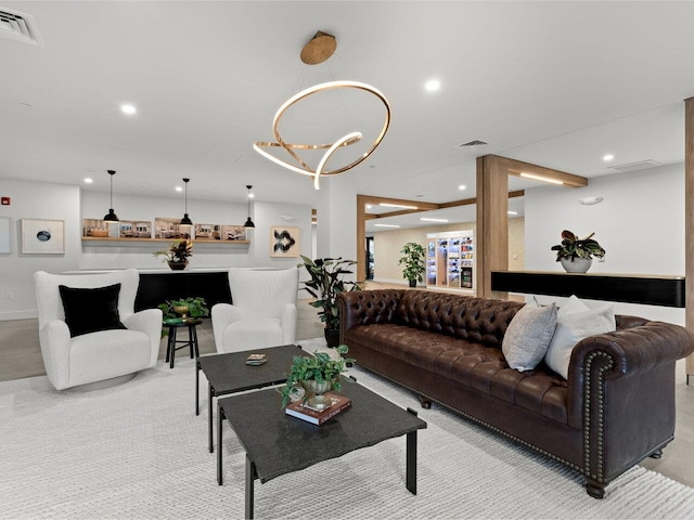 125 Cambrian Way Unit 609, Burlington, VT 05401 - living room featuring light carpet, recessed lighting, and a chandelier