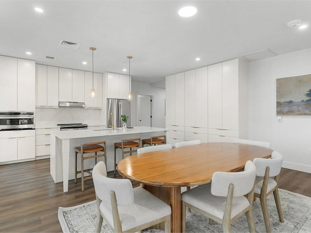 125 Cambrian Way Unit 609, Burlington, VT 05401 - dining room with dark wood-style flooring, recessed lighting, and baseboards