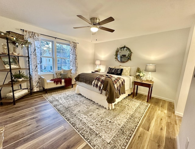 bedroom featuring wood-type flooring and ceiling fan