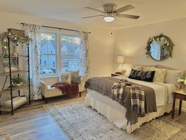 bedroom featuring ceiling fan and hardwood / wood-style floors