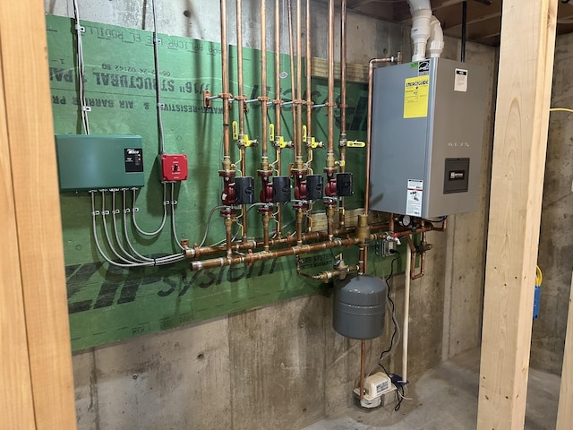 utility room featuring tankless water heater