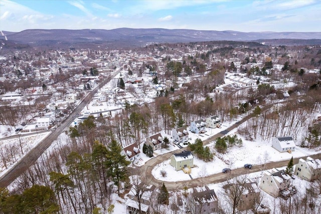 snowy aerial view featuring a mountain view