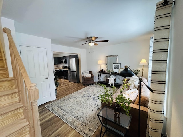 interior space with ceiling fan and wood finished floors