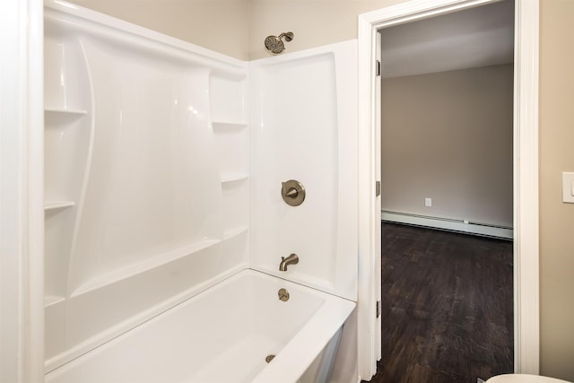 bathroom featuring shower / bath combination, wood-type flooring, and a baseboard radiator