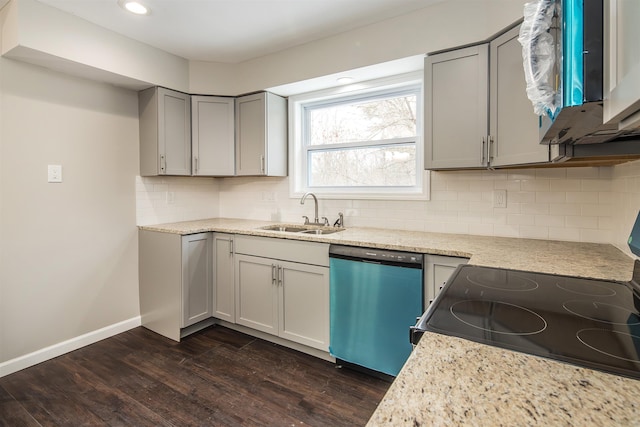 kitchen with dark hardwood / wood-style flooring, tasteful backsplash, gray cabinetry, stainless steel appliances, and sink