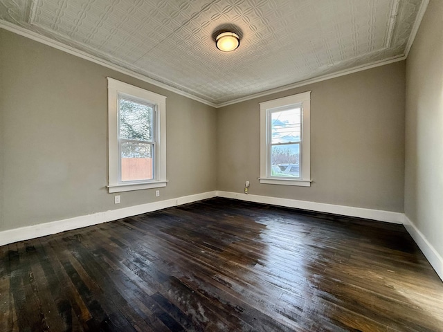 empty room featuring crown molding, a healthy amount of sunlight, and dark hardwood / wood-style floors