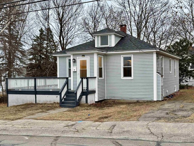 bungalow with a wooden deck