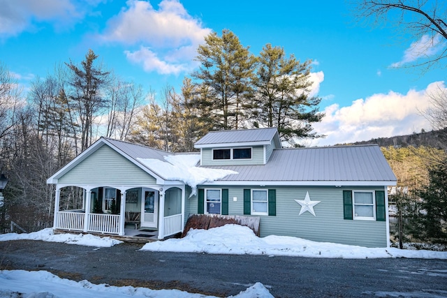 874 Vt Route 100, Ludlow, VT 05149 - view of front facade featuring a porch