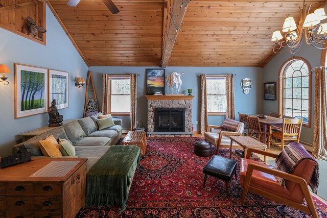 874 Vt Route 100, Ludlow, VT 05149 - living room with a fireplace, vaulted ceiling with beams, ceiling fan with notable chandelier, and wood ceiling