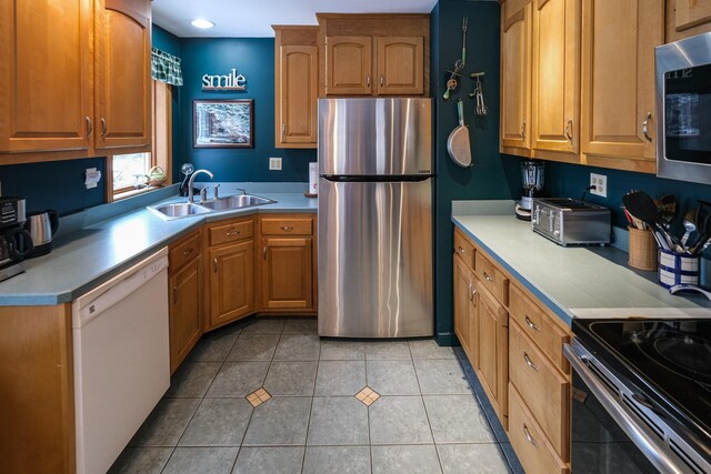 874 Vt Route 100, Ludlow, VT 05149 - kitchen featuring sink, light tile patterned floors, and stainless steel appliances
