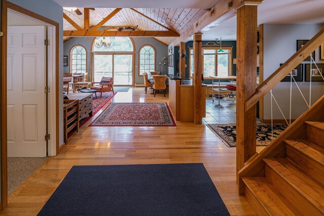 874 Vt Route 100, Ludlow, VT 05149 - foyer featuring hardwood / wood-style flooring, vaulted ceiling with beams, wooden ceiling, and an inviting chandelier