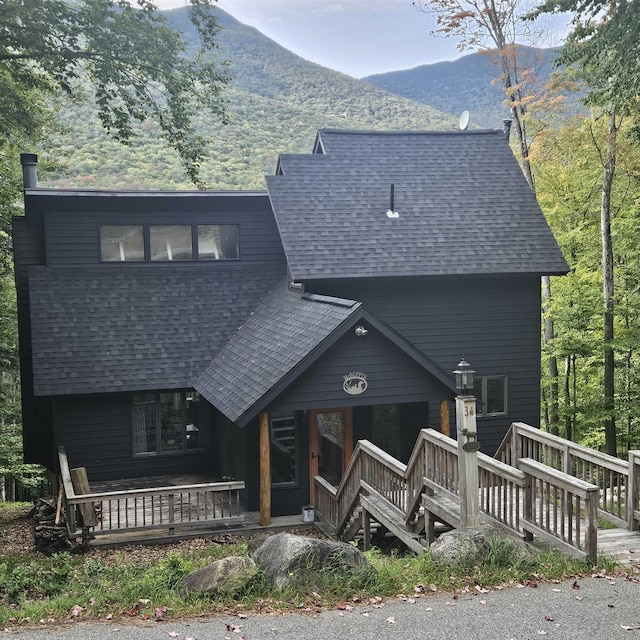 view of front of home featuring a mountain view and a porch