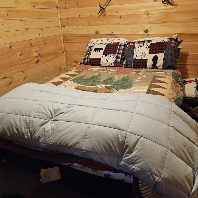 bedroom with wood walls