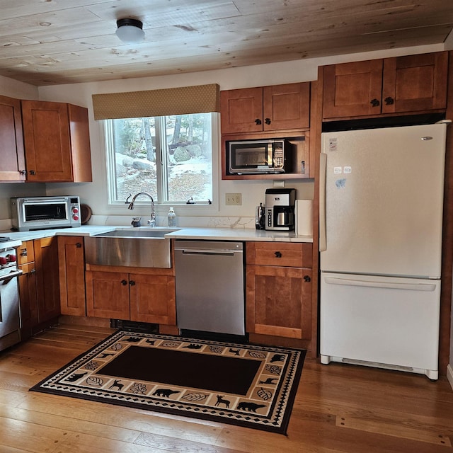 kitchen featuring dishwasher, sink, wooden ceiling, dark wood-type flooring, and white fridge